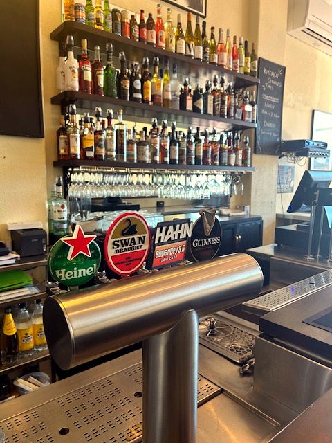 Beer taps and the back bar at Whatley's